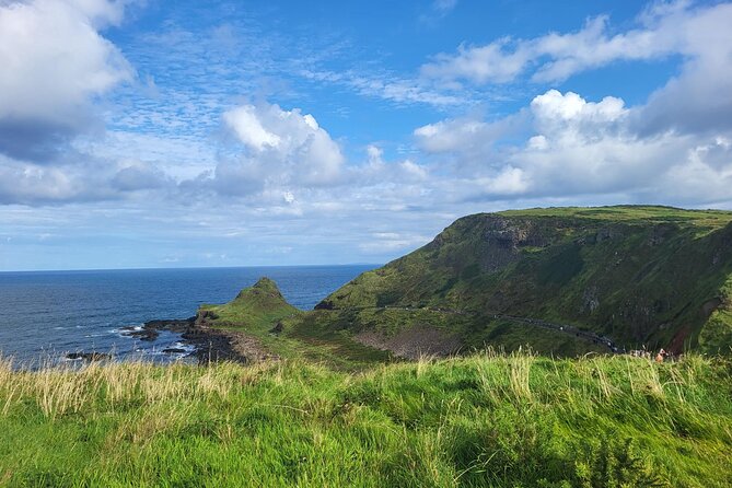 Five Star Giant's Causeway & Belfast Luxury Private Excursion. - Dunluce Castle hangs above the sea